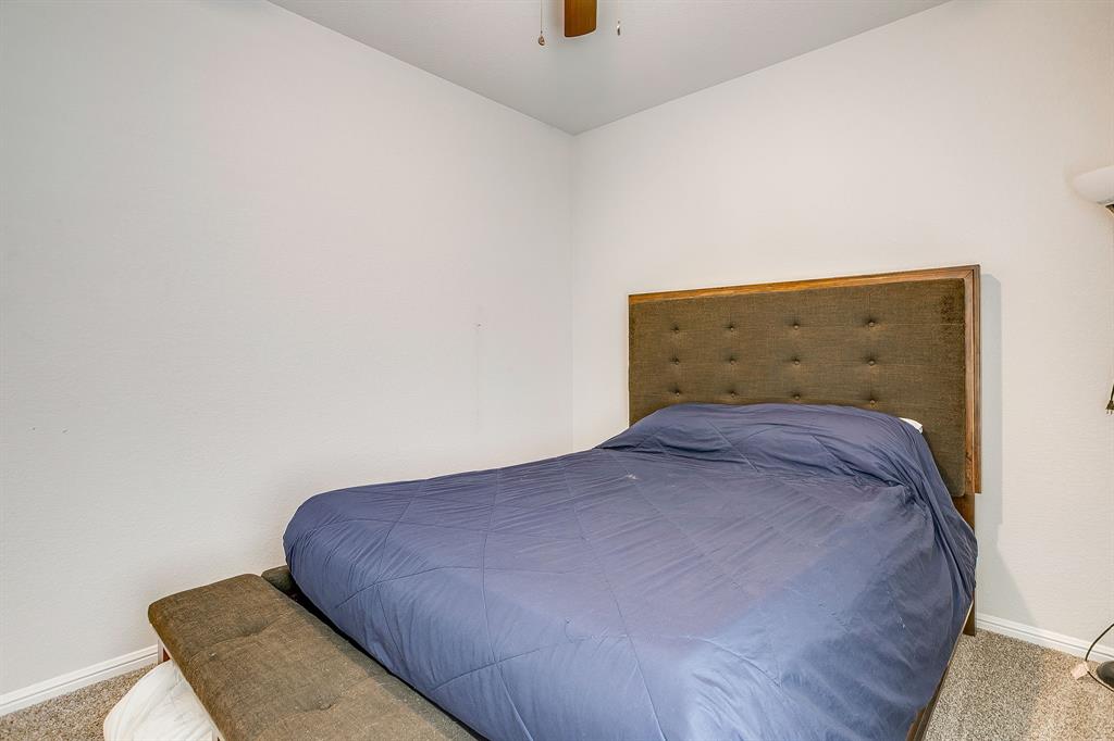 2313 Stallings Road Fort Worth, TX 76108 - Photo 22 of 30 a bedroom with a bed