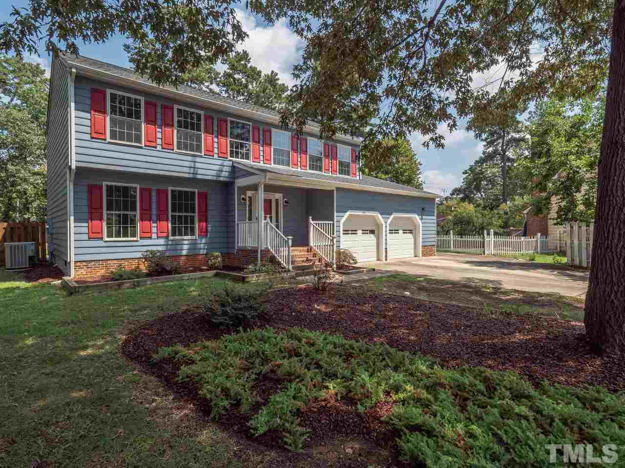 1901 Grove Point Court Raleigh, NC 27609 - Photo 1 of 26 a front view of a house with a yard