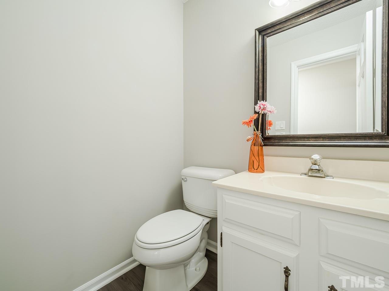 1901 Grove Point Court Raleigh, NC 27609 - Photo 12 of 26 a bathroom with a sink and a toilet