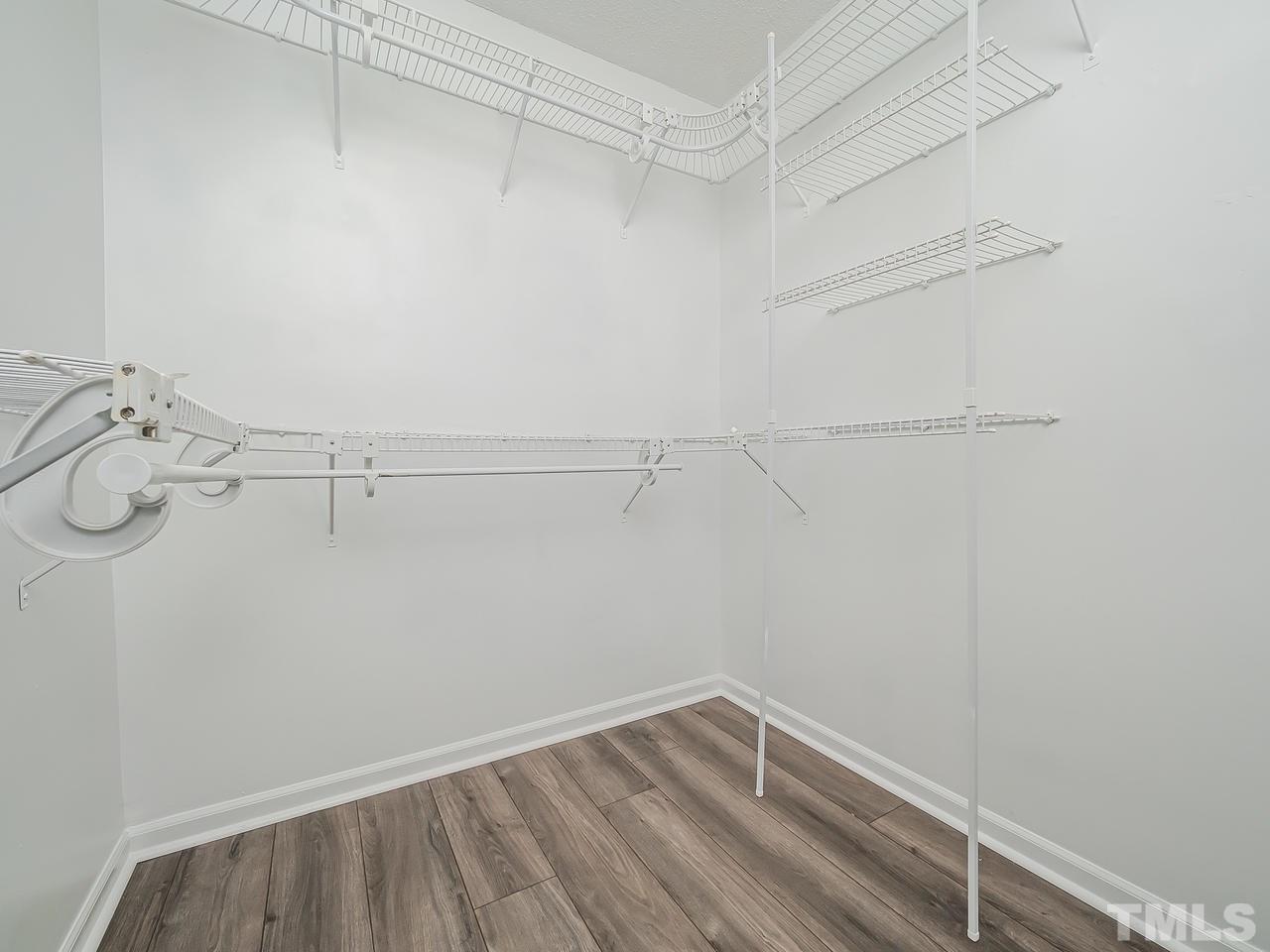 1901 Grove Point Court Raleigh, NC 27609 - Photo 16 of 26 a view of a room with racks on the wall