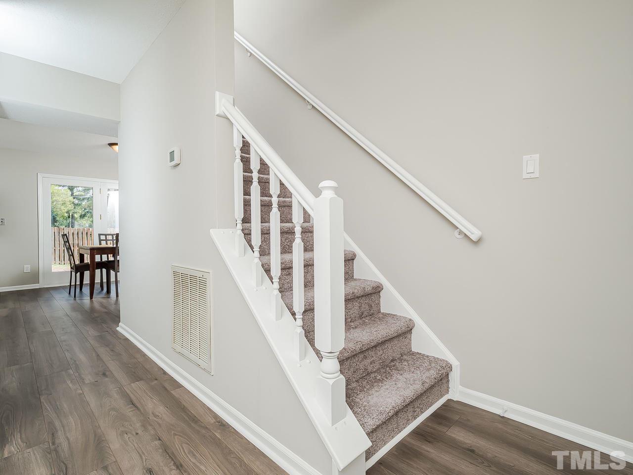 1901 Grove Point Court Raleigh, NC 27609 - Photo 3 of 26 a view of entryway and hall with wooden floor