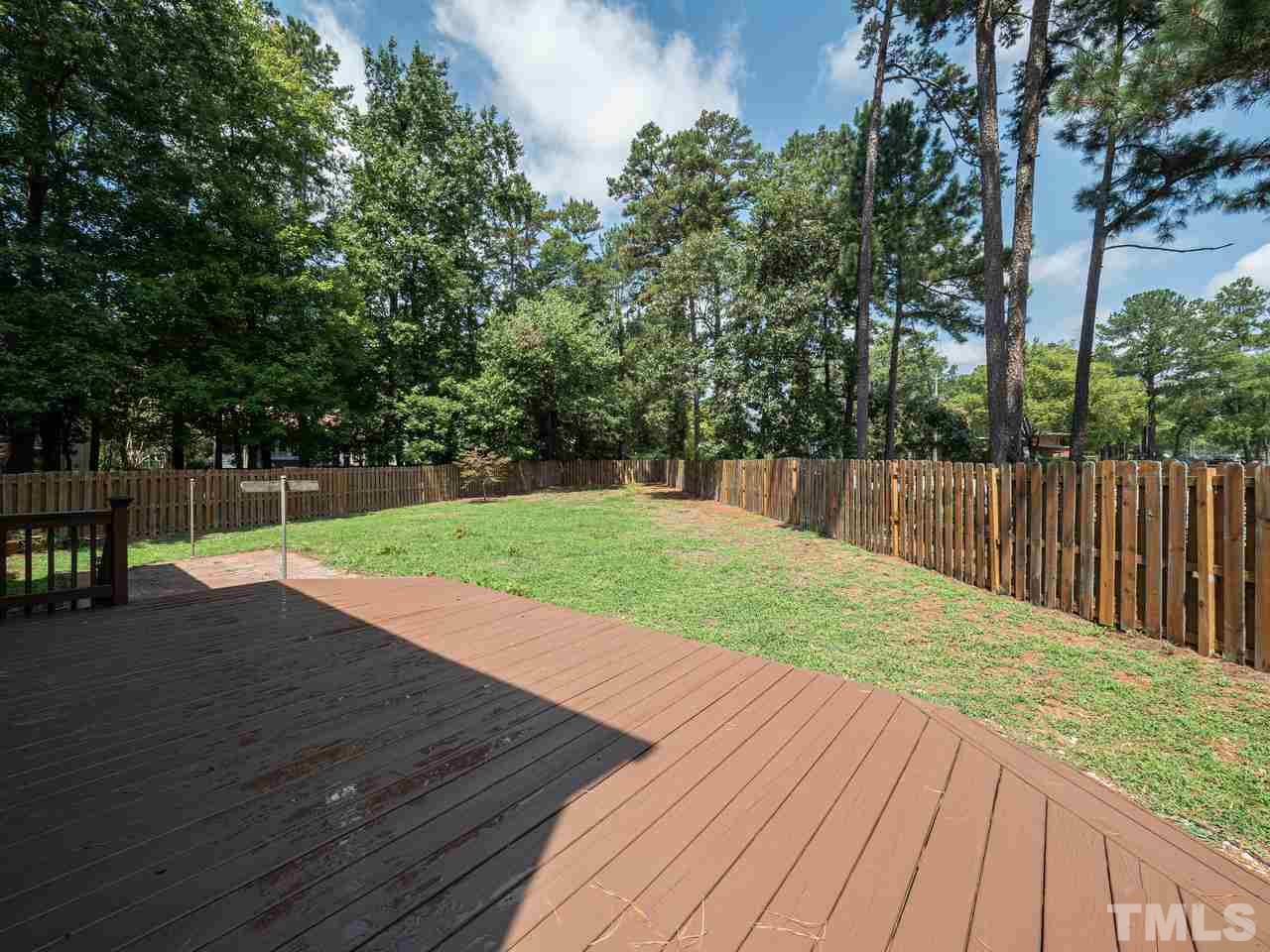 1901 Grove Point Court Raleigh, NC 27609 - Photo 22 of 26 a view of a backyard with wooden floor