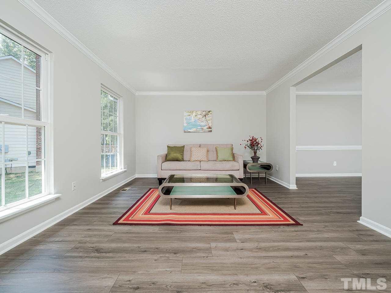 1901 Grove Point Court Raleigh, NC 27609 - Photo 5 of 26 a view of bed room with wooden floor and windows