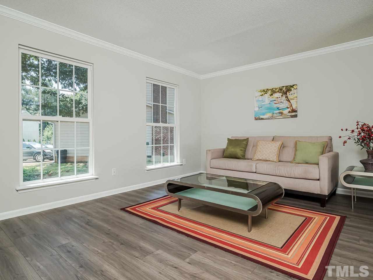 1901 Grove Point Court Raleigh, NC 27609 - Photo 6 of 26 a living room with furniture and a window