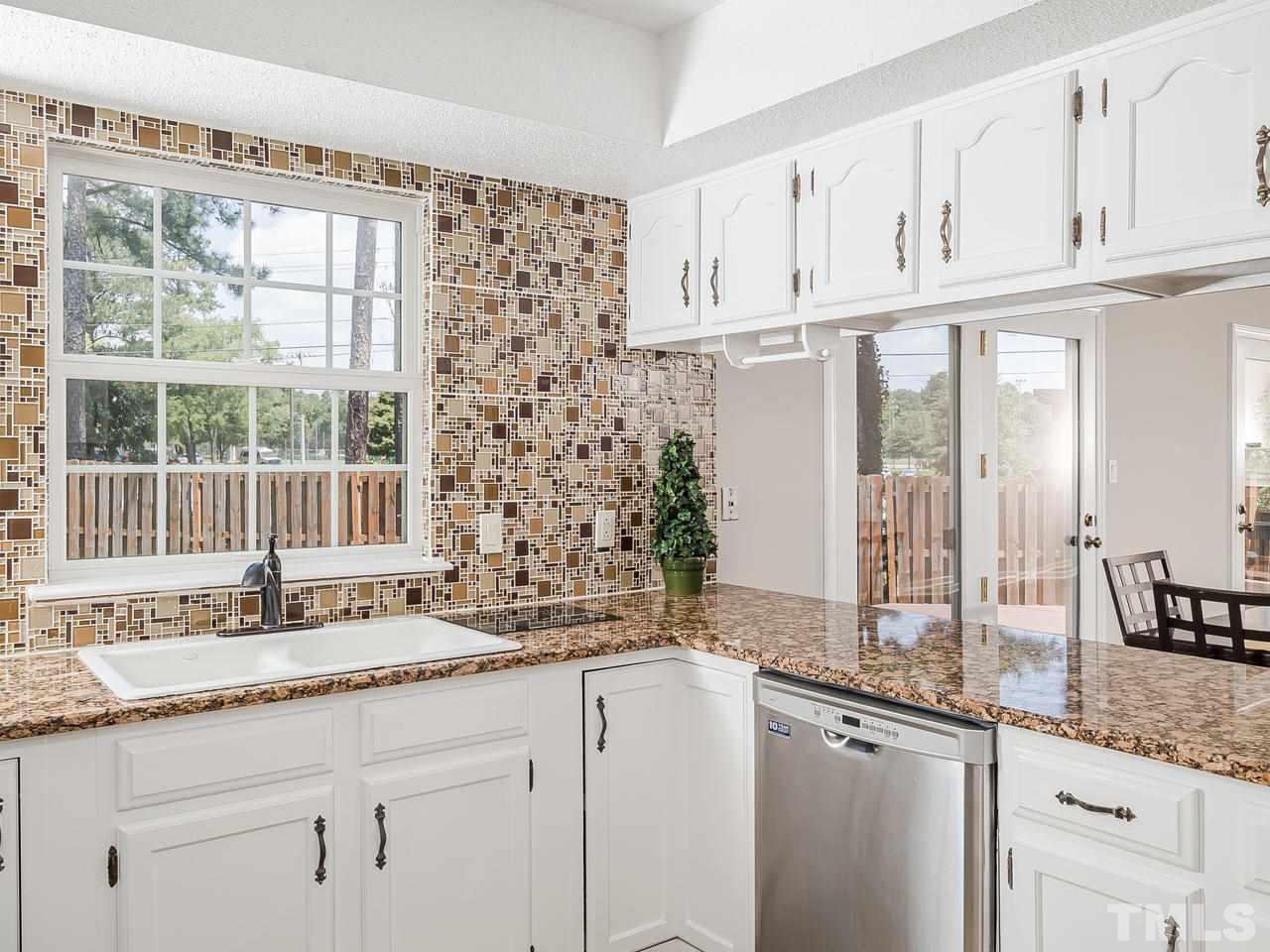 1901 Grove Point Court Raleigh, NC 27609 - Photo 8 of 26 a bathroom with granite countertop a sink and a window