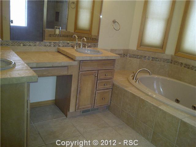 18518 Wetherill Road Monument, CO 80132 - Photo 11 of 16 Luxurious 5-pc Master Bath with spa tub