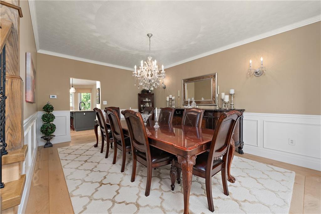 548 Lang Road Sewickley, PA 15143 - Photo 11 of 49 a view of a dining room with furniture and chandelier
