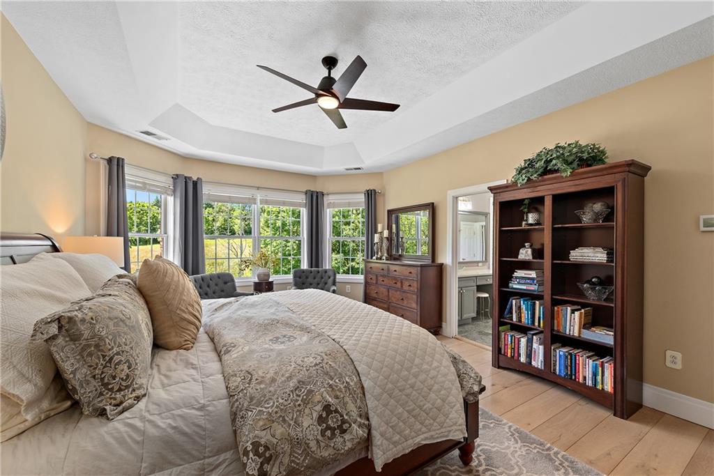 548 Lang Road Sewickley, PA 15143 - Photo 14 of 49 a bed sitting in a bedroom next to a large window