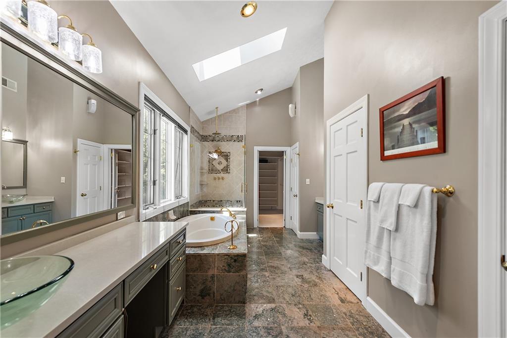 548 Lang Road Sewickley, PA 15143 - Photo 16 of 49 a spacious bathroom with sinks mirror and a shower