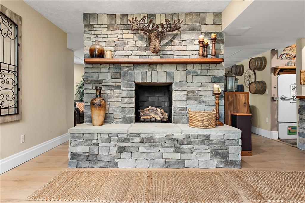 548 Lang Road Sewickley, PA 15143 - Photo 26 of 49 a bedroom with a bed and a fireplace