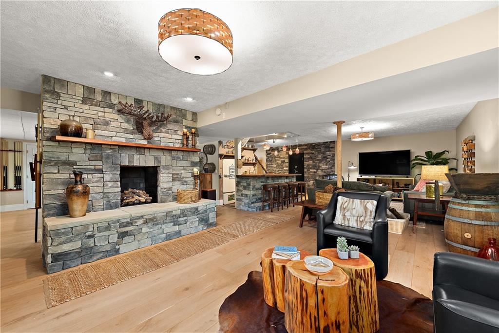 548 Lang Road Sewickley, PA 15143 - Photo 27 of 49 a living room with furniture and a fireplace