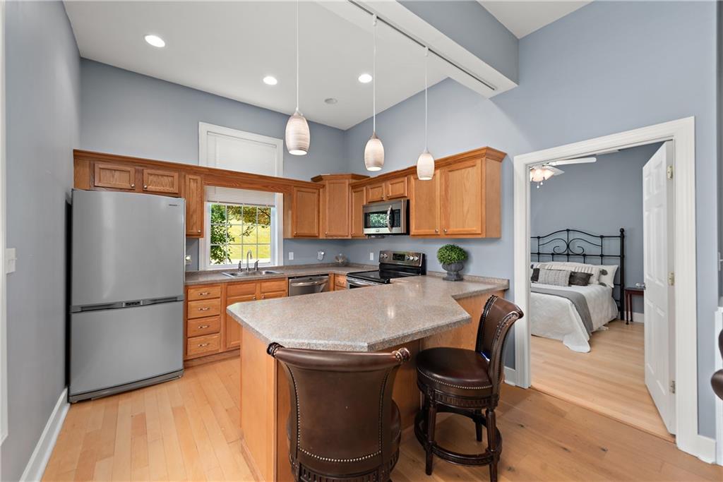 548 Lang Road Sewickley, PA 15143 - Photo 31 of 49 a large kitchen with a table and chairs in it