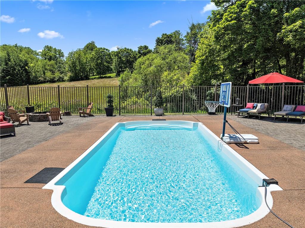 548 Lang Road Sewickley, PA 15143 - Photo 35 of 49 a swimming pool with outdoor seating and yard
