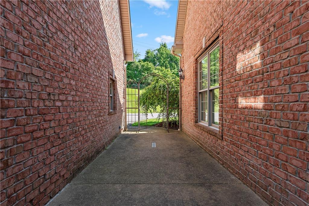 548 Lang Road Sewickley, PA 15143 - Photo 40 of 49 a view of a brick wall with windows in front of brick house