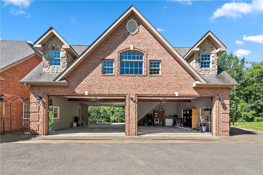 548 Lang Road Sewickley, PA 15143 - Photo 41 of 49 a front view of a house with a yard