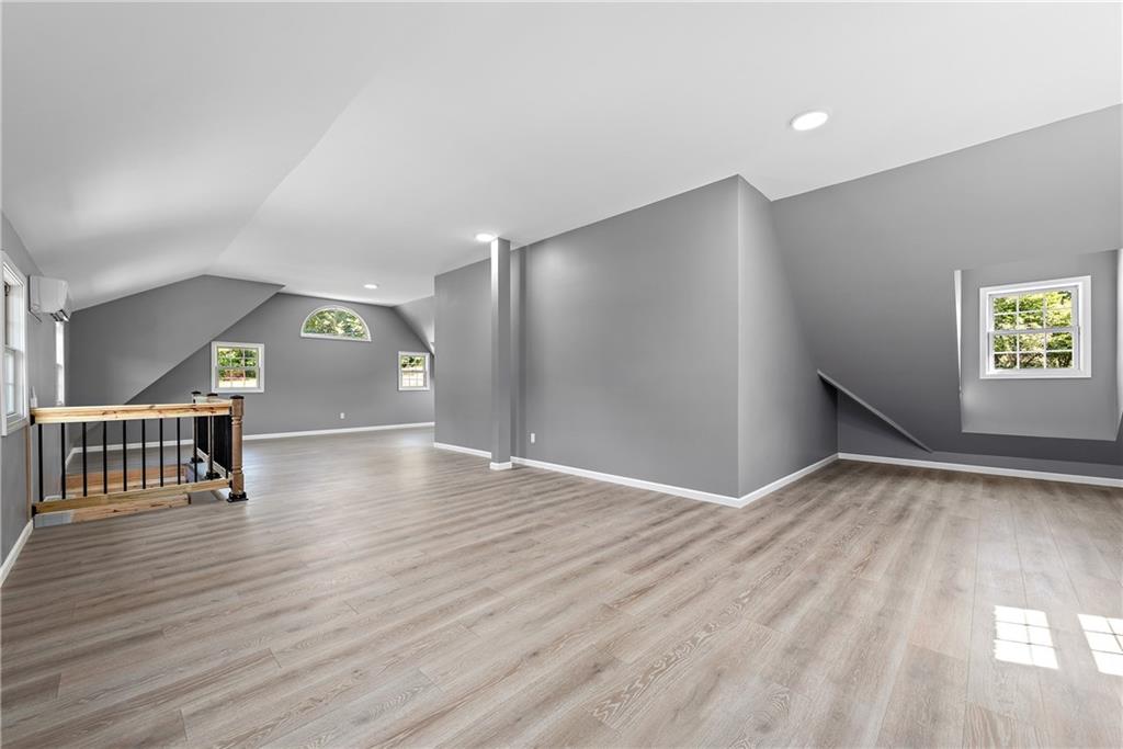 548 Lang Road Sewickley, PA 15143 - Photo 44 of 49 a view of an empty room with window and wooden floor
