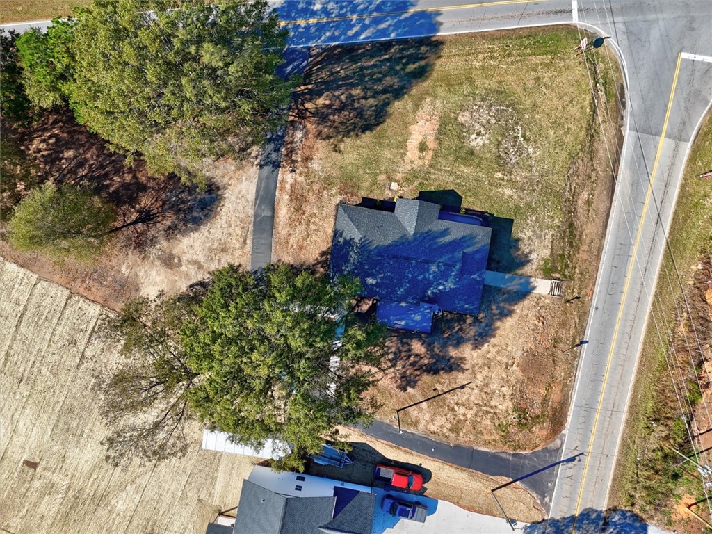 801 Cherokee Road Pelzer, SC 29669 - Photo 37 of 45 An aerial perspective showcases a spacious lot with surrounding natural beauty and road access.