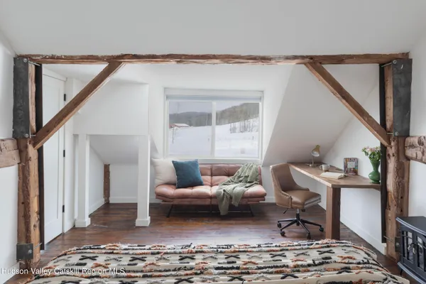 a living room with furniture and a rug