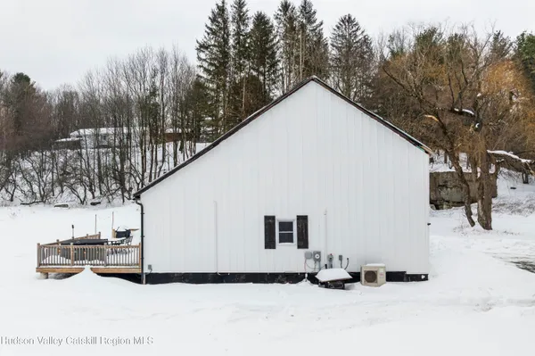 a view of a house with a snow in the yard