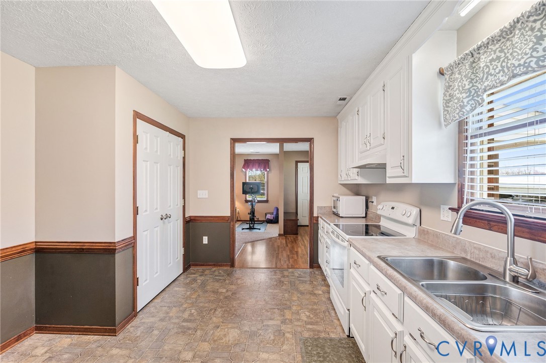 3411 Spring Run Road Mechanicsville, VA 23111 - Photo 21 of 41 a kitchen with sink cabinets and counter