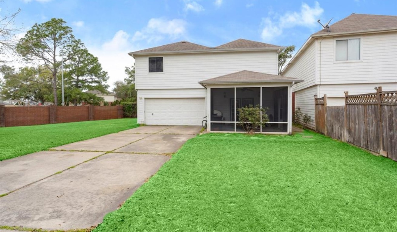 15919 Timber Chase Drive Houston, TX 77082 - Photo 5 of 6 a view of a house with yard and a garden