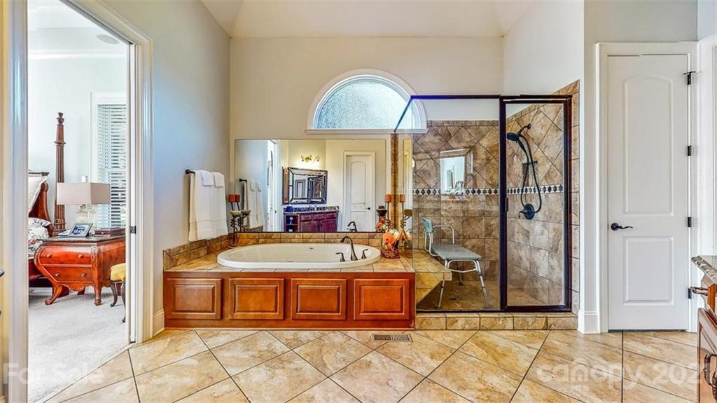 8116 Balcony Bridge Road Huntersville, NC 28078 - Photo 17 of 31 a spacious bathroom with a tub and shower