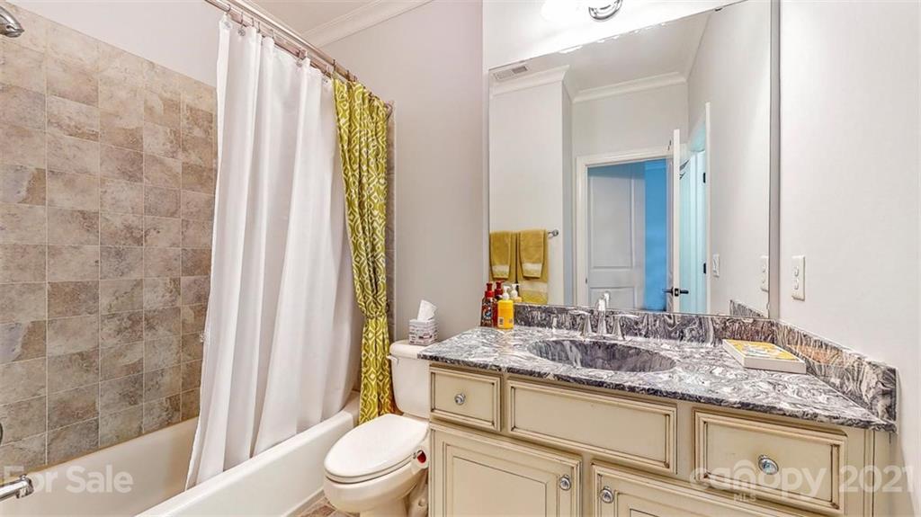 8116 Balcony Bridge Road Huntersville, NC 28078 - Photo 19 of 31 a bathroom with a granite countertop sink toilet and shower