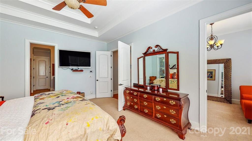 8116 Balcony Bridge Road Huntersville, NC 28078 - Photo 20 of 31 a bedroom with double bed and a flat tv screen on dresser