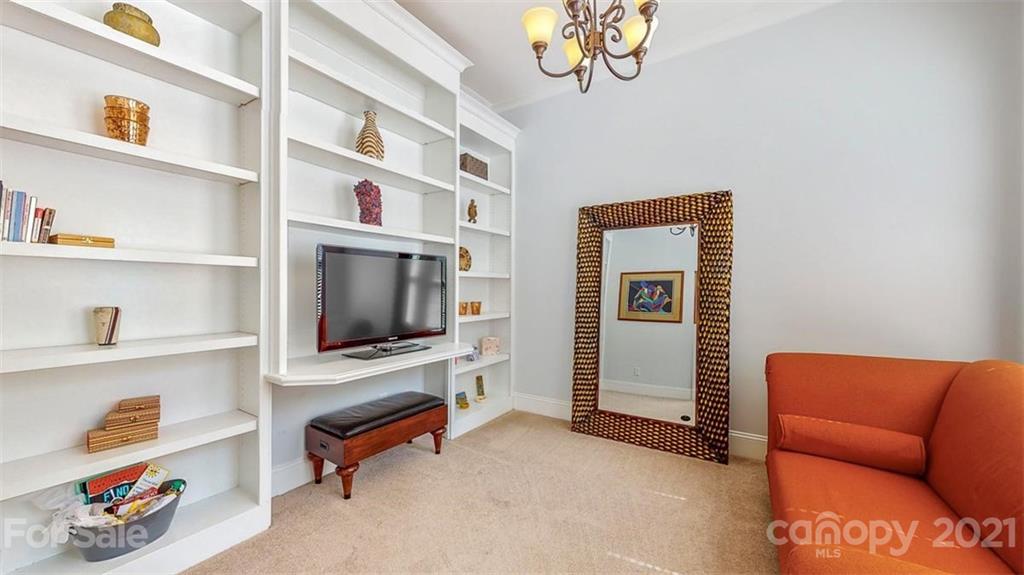 8116 Balcony Bridge Road Huntersville, NC 28078 - Photo 22 of 31 a living room with furniture and a flat screen tv