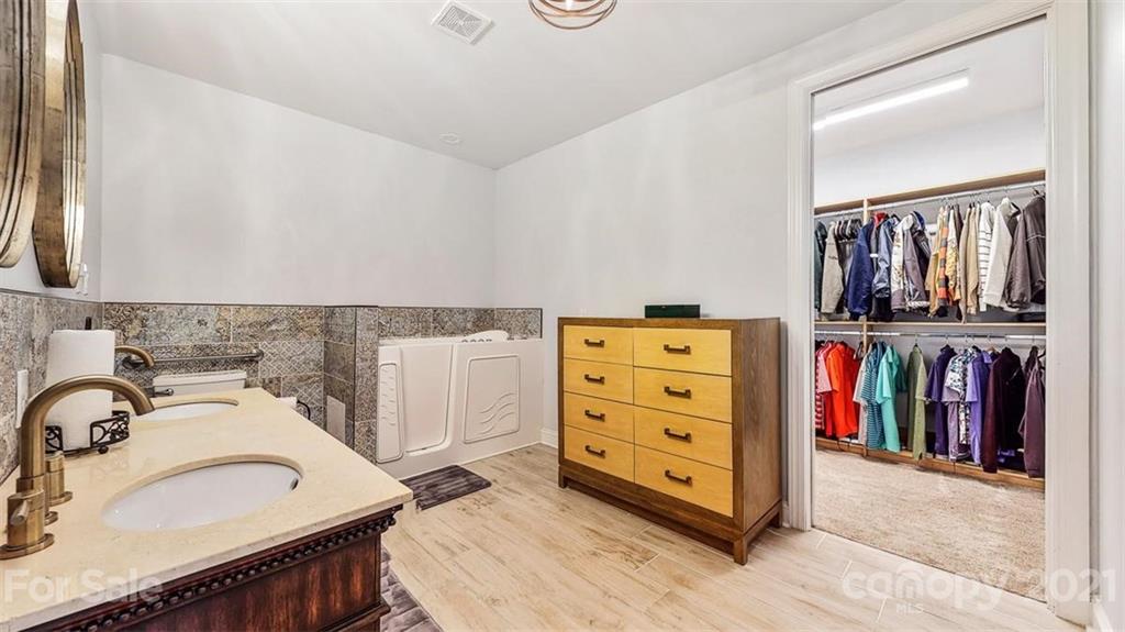8116 Balcony Bridge Road Huntersville, NC 28078 - Photo 27 of 31 a view of a bedroom with storage and utility
