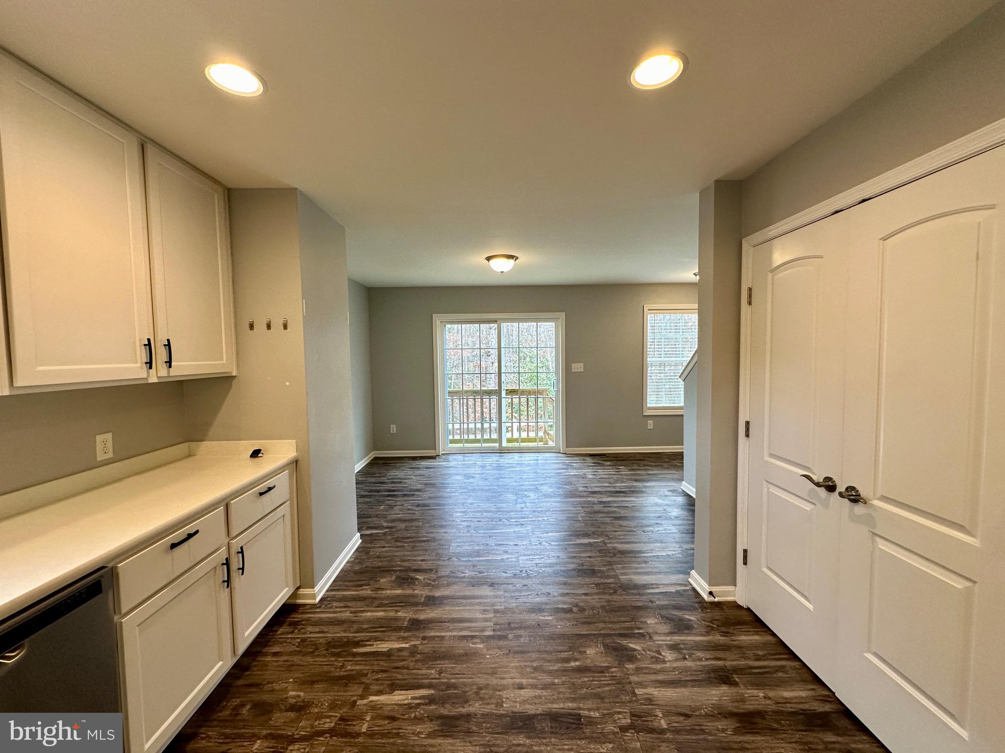 326 Sweeping Mist Circle Frederica, DE 19946 - Photo 14 of 37 a view of a kitchen with a sink and wooden floor