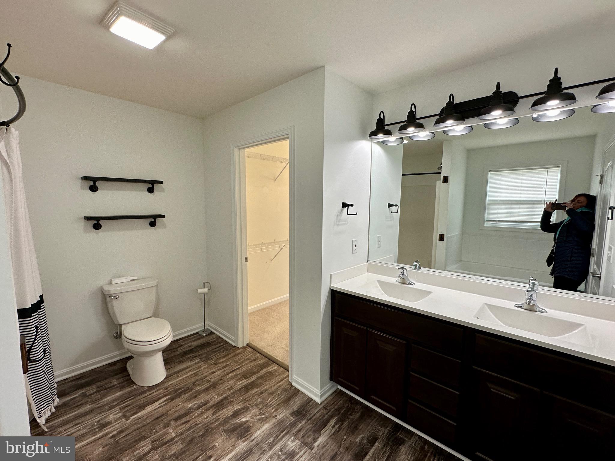 326 Sweeping Mist Circle Frederica, DE 19946 - Photo 26 of 37 a bathroom with a sink and a mirror