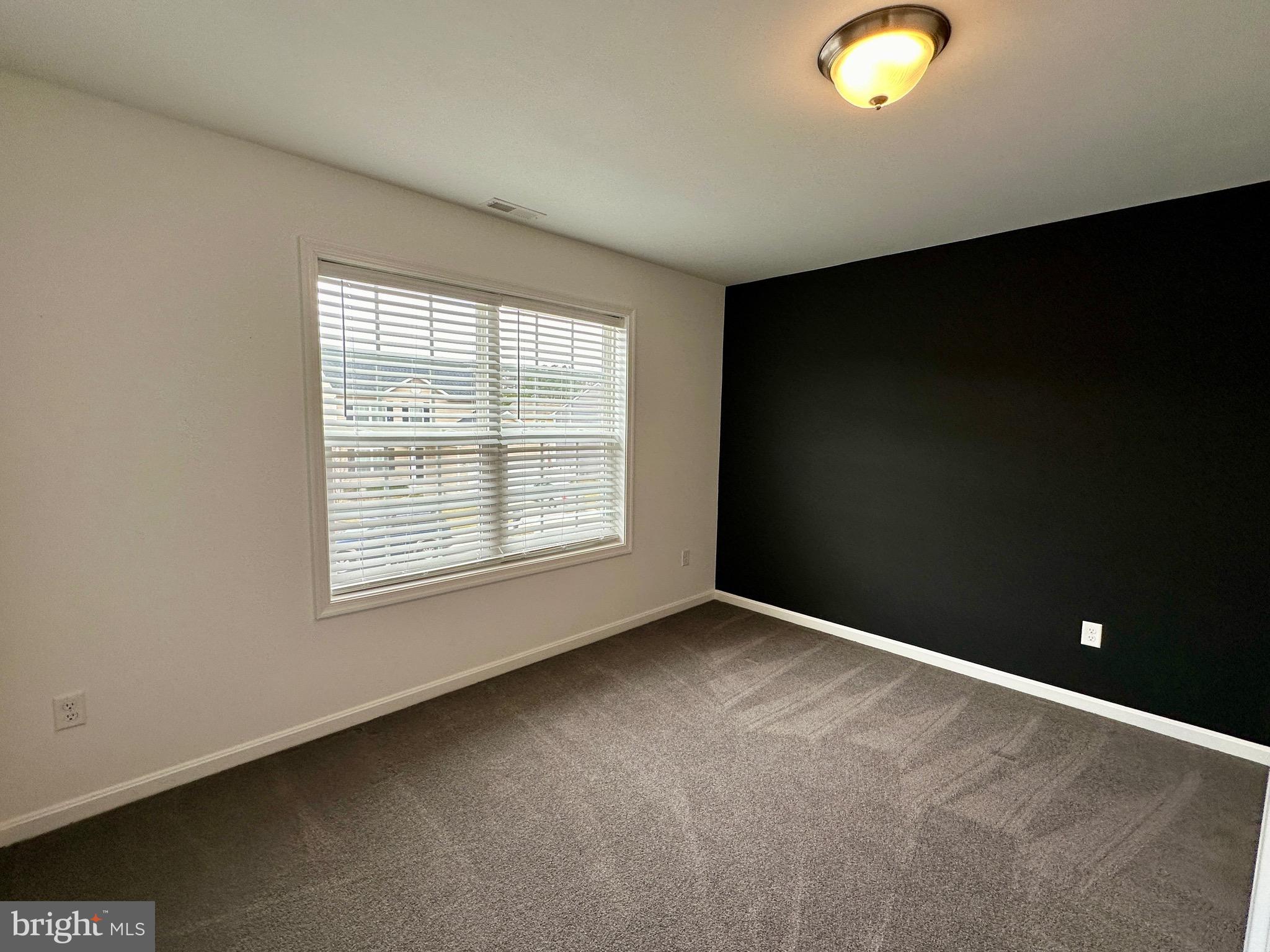 326 Sweeping Mist Circle Frederica, DE 19946 - Photo 28 of 37 an empty room with a window