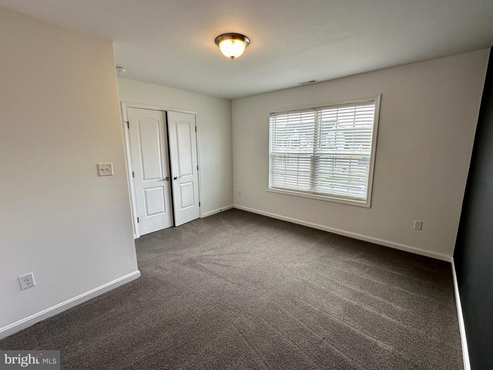 326 Sweeping Mist Circle Frederica, DE 19946 - Photo 30 of 37 an empty room with a empty space and windows