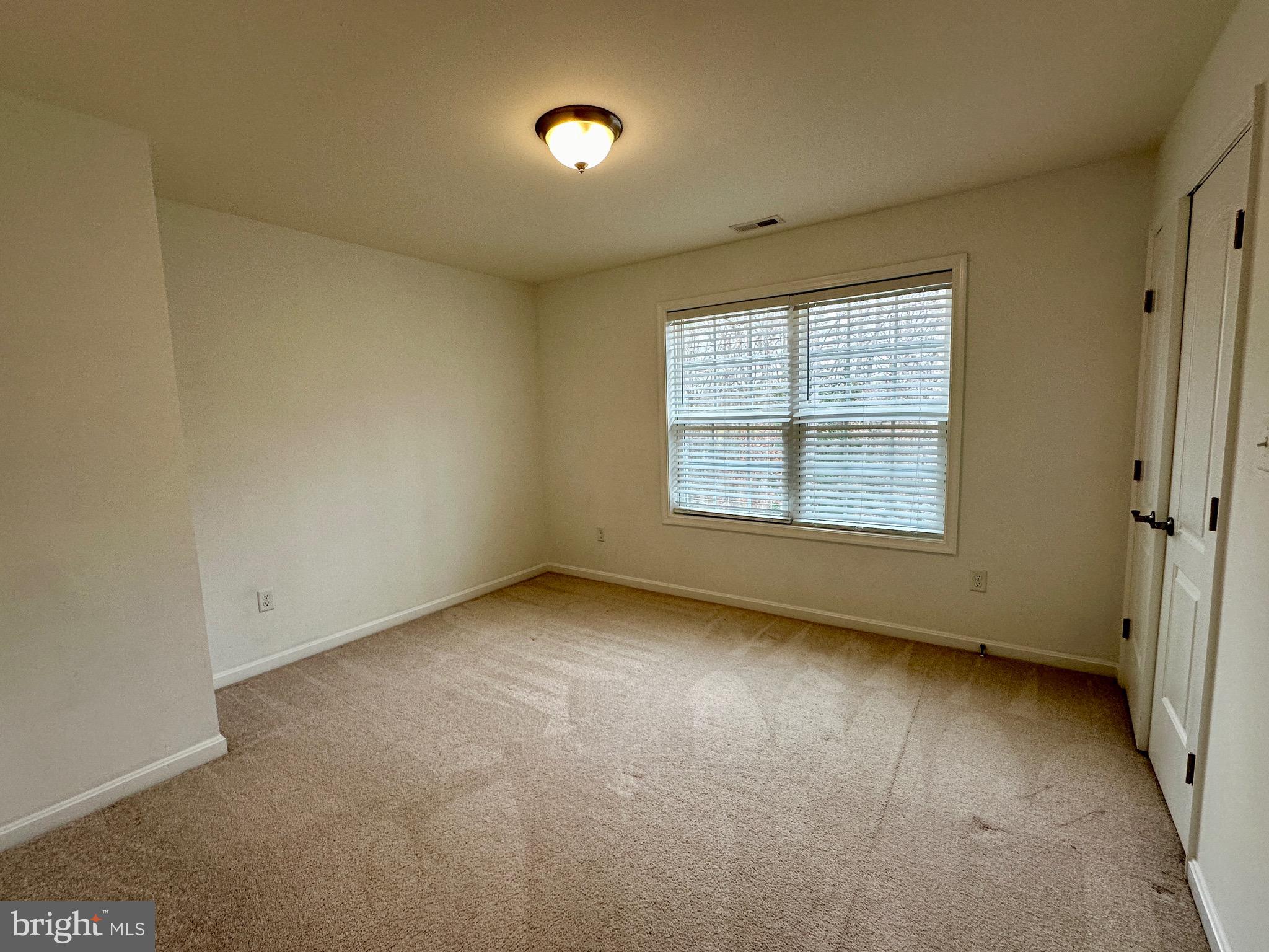 326 Sweeping Mist Circle Frederica, DE 19946 - Photo 32 of 37 an empty room with a window