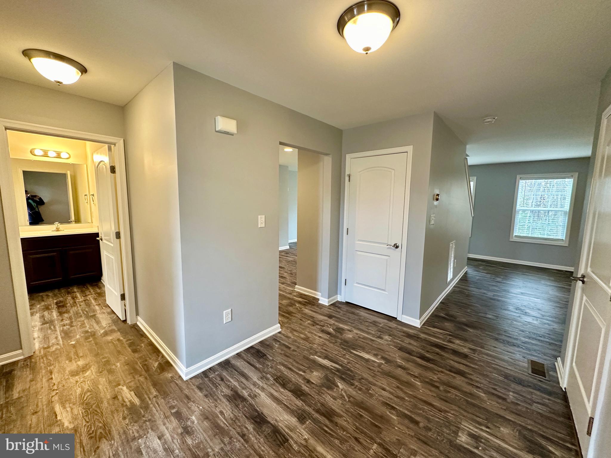 326 Sweeping Mist Circle Frederica, DE 19946 - Photo 5 of 37 wooden floor in a hall with an entryway