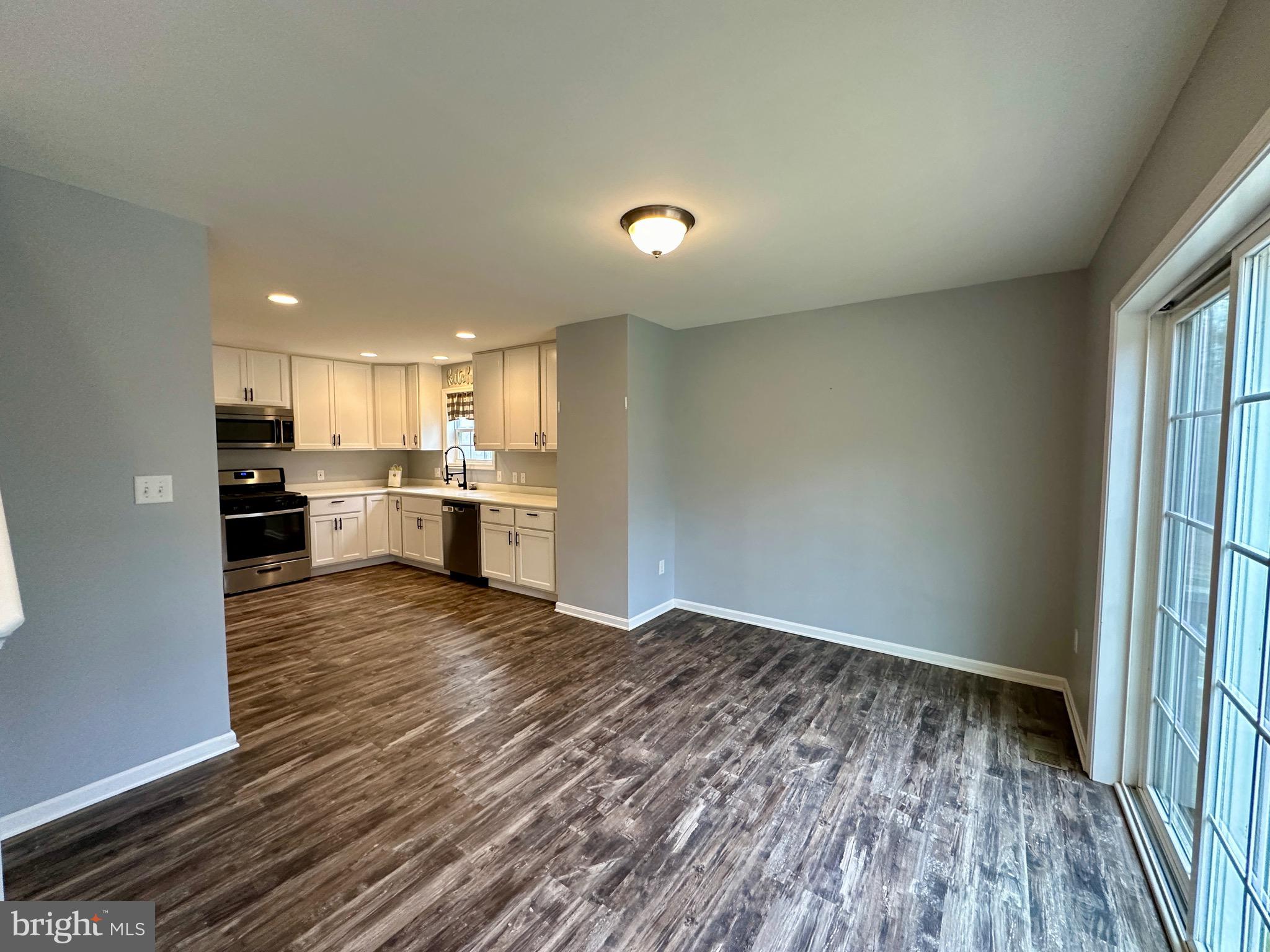 326 Sweeping Mist Circle Frederica, DE 19946 - Photo 9 of 37 a view of kitchen and wooden floor