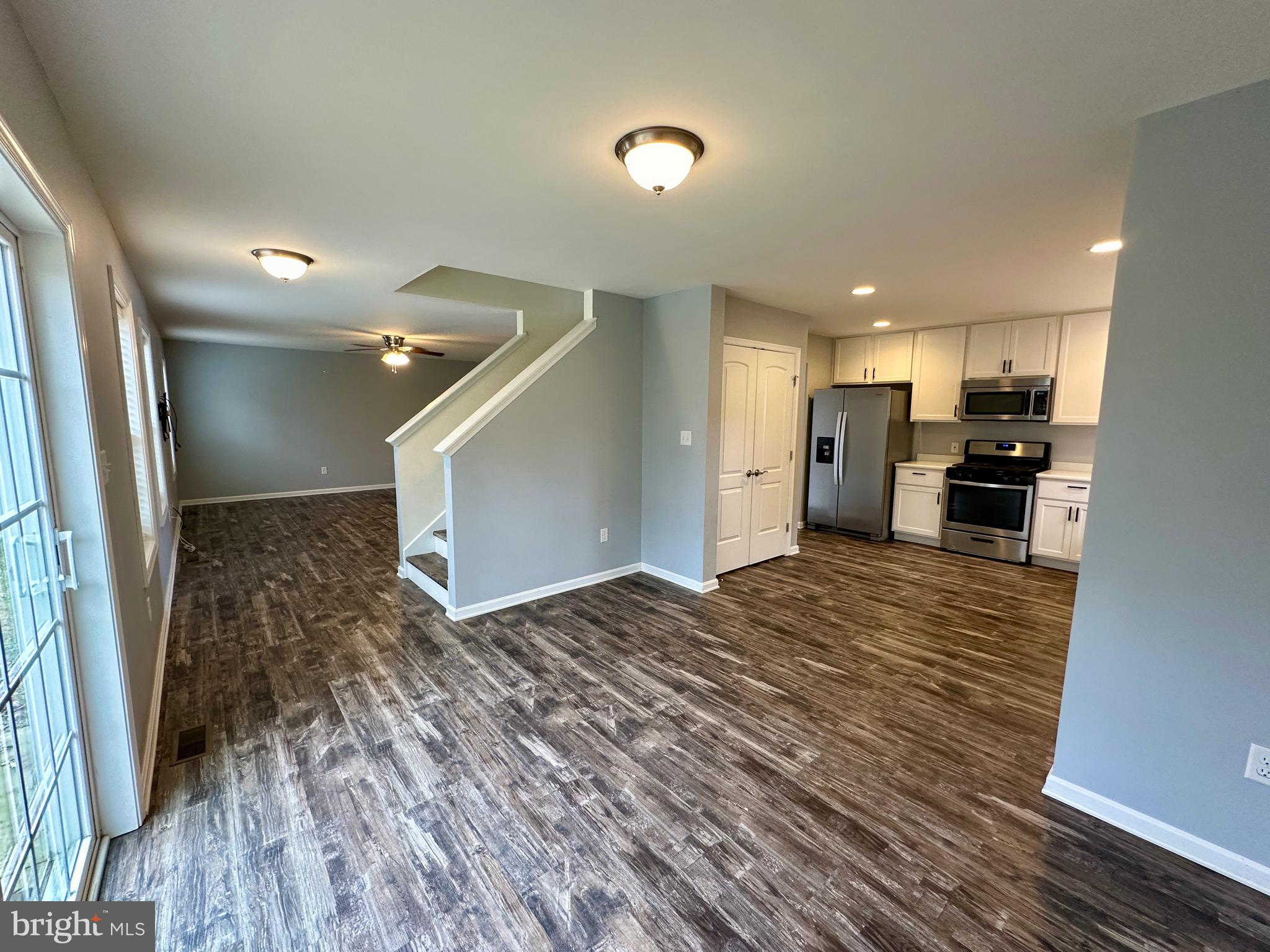 326 Sweeping Mist Circle Frederica, DE 19946 - Photo 10 of 37 a view of empty room with wooden floor