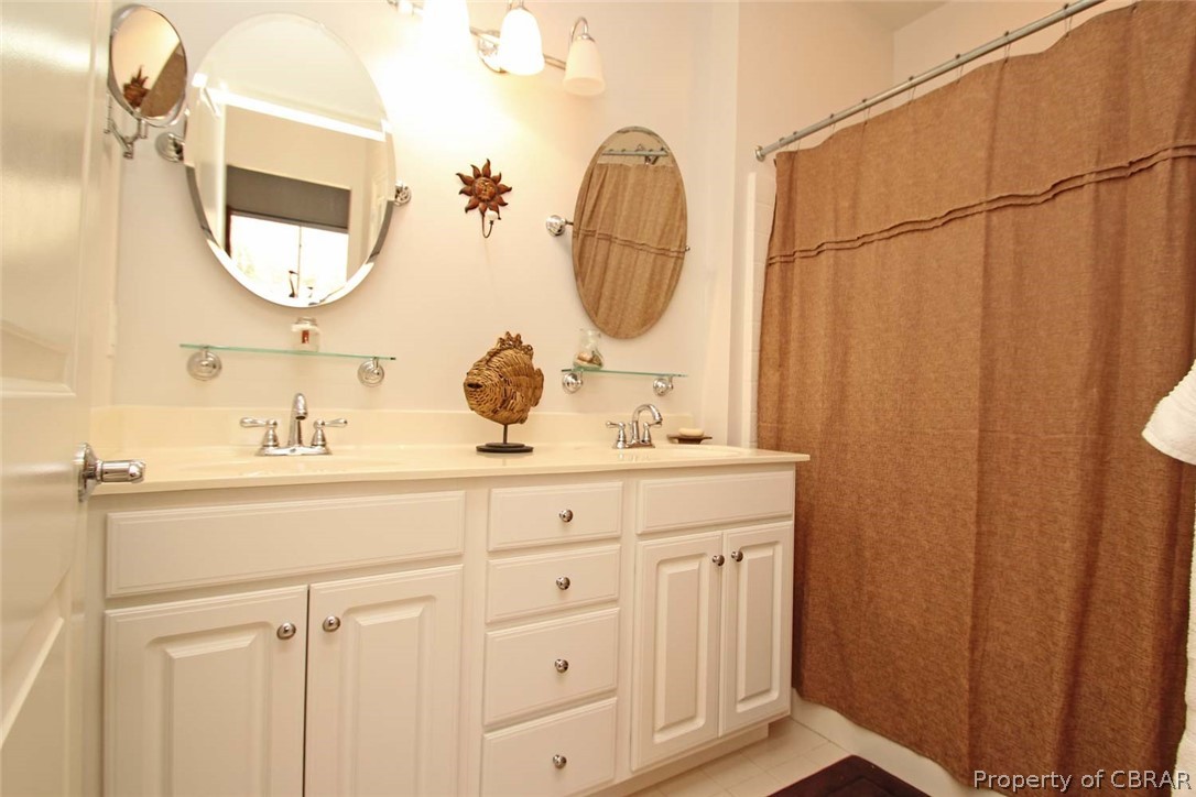6819 Windmill Point Road White Stone, VA 22578 - Photo 22 of 50 Main Floor Bedroom's bathroom has a shower/tub combo.