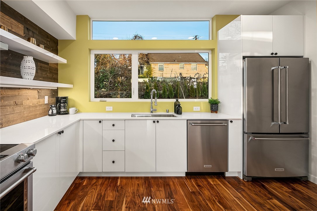1306 Yakima Avenue South Seattle, WA 98144 - Photo 11 of 29 a view of a kitchen with wooden floor and electronic appliances