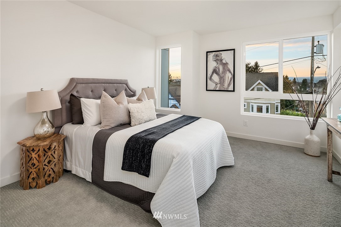 1306 Yakima Avenue South Seattle, WA 98144 - Photo 16 of 29 a bedroom with a bed and a window