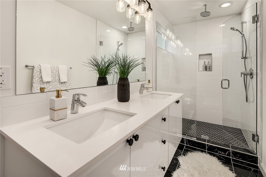 1306 Yakima Avenue South Seattle, WA 98144 - Photo 18 of 29 a bathroom with a sink double vanity and a mirror