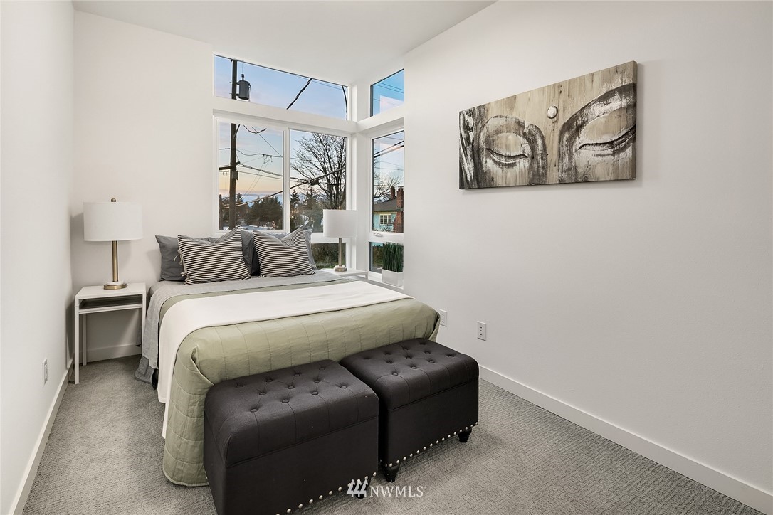 1306 Yakima Avenue South Seattle, WA 98144 - Photo 20 of 29 a bedroom with a bed and lamp