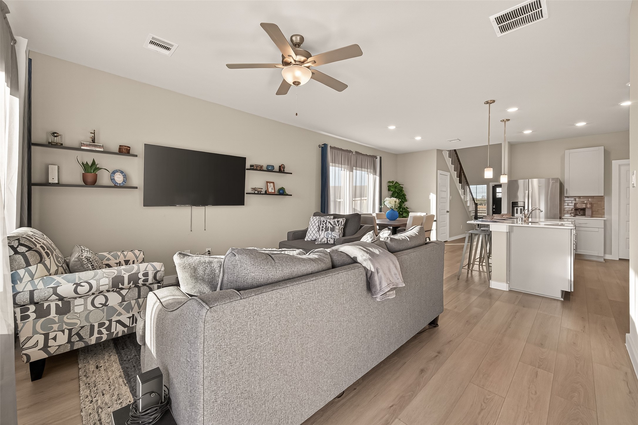 5516 Madden Lane Houston, TX 77048 - Photo 12 of 33 a living room with furniture and a flat screen tv