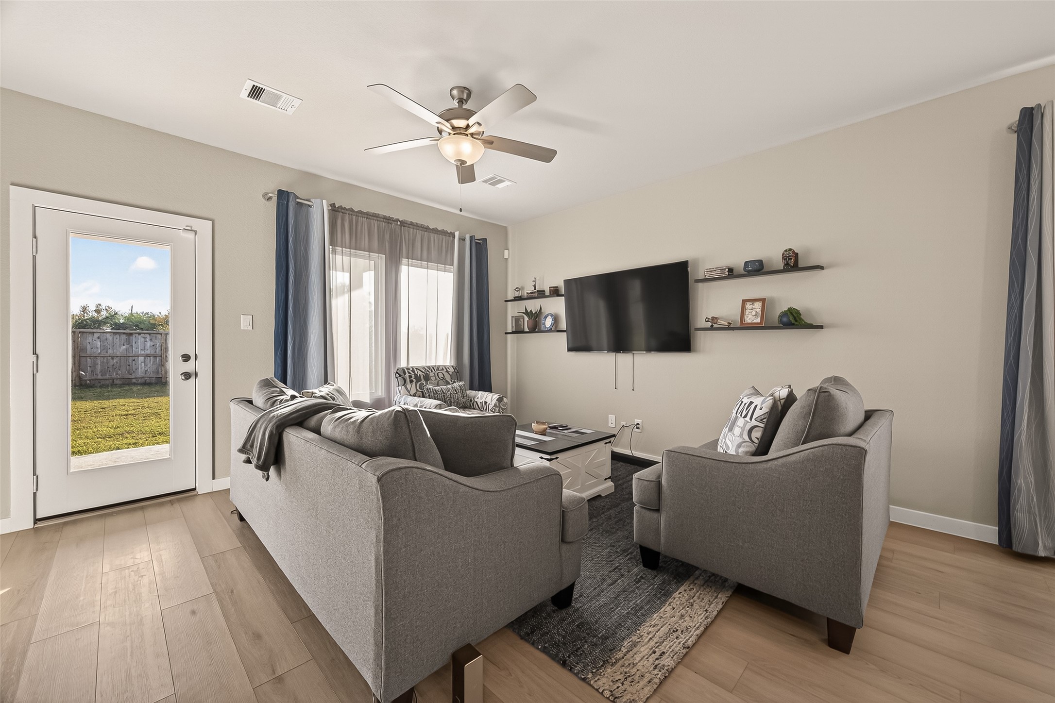 5516 Madden Lane Houston, TX 77048 - Photo 13 of 33 a living room with furniture and a flat screen tv
