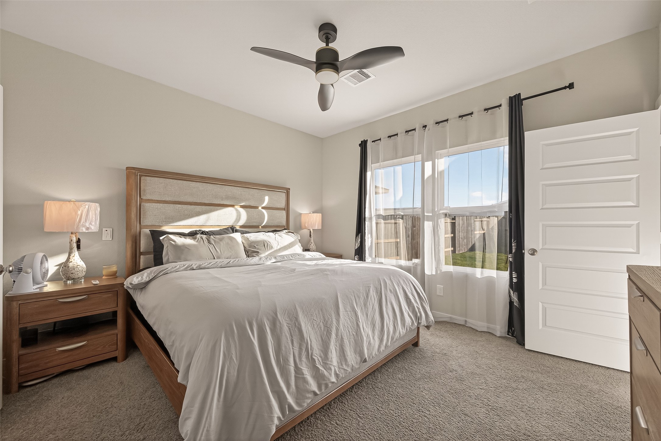 5516 Madden Lane Houston, TX 77048 - Photo 15 of 33 a bedroom with a bed and a window