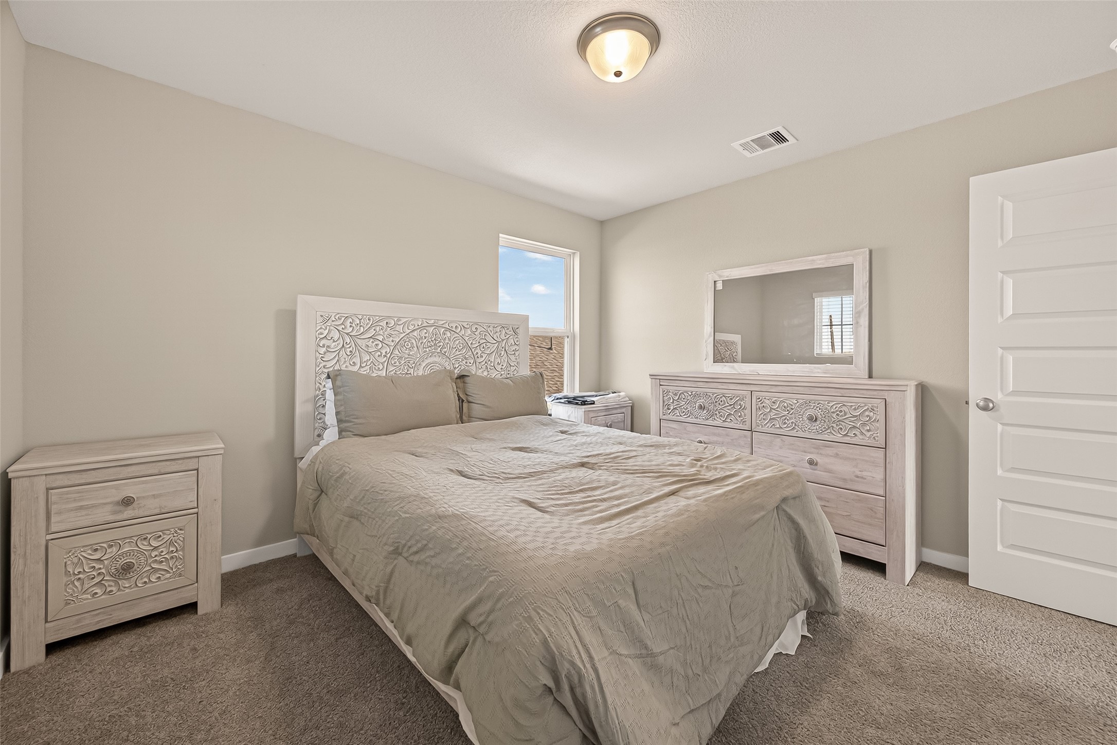 5516 Madden Lane Houston, TX 77048 - Photo 24 of 33 a bedroom with a bed and a dresser