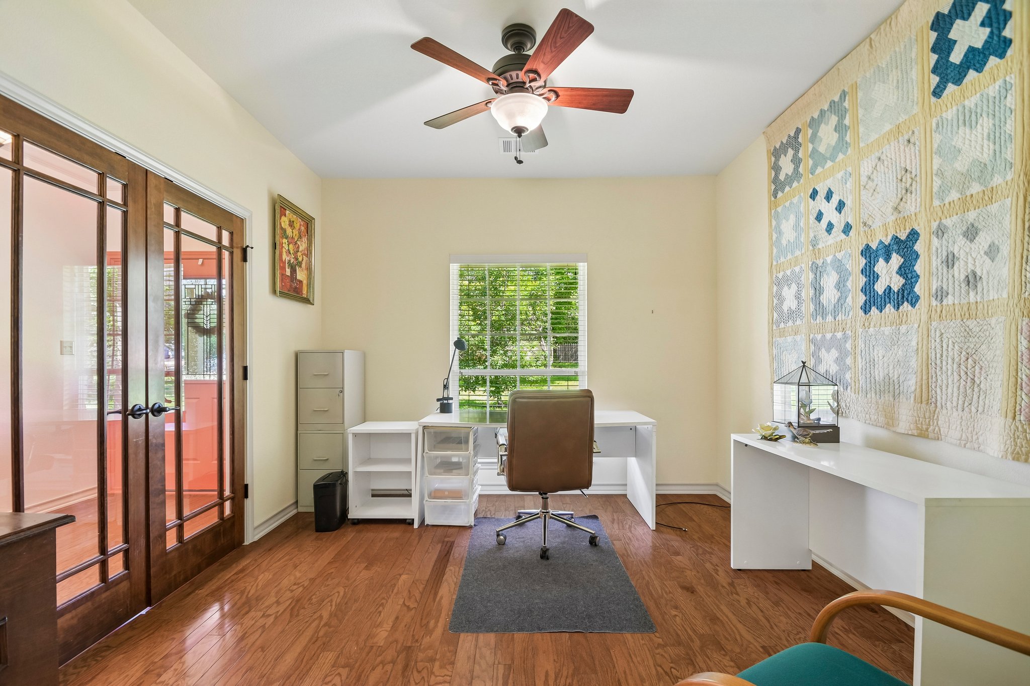 307 West 4th Street Elgin, TX 78621 - Photo 14 of 40 Interior room featuring wood-finish flooring and a central ceiling fan with integrated lighting