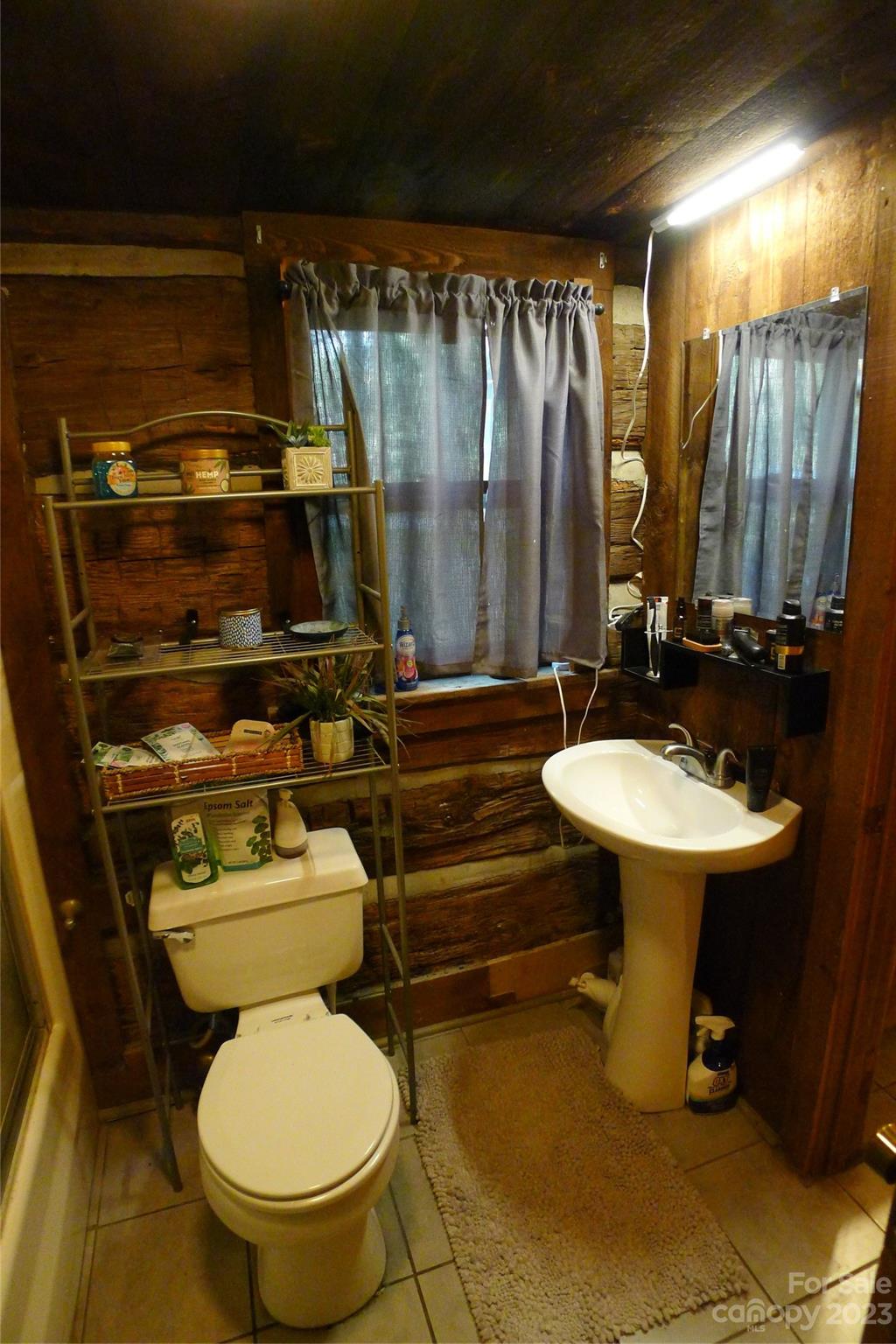 334 Ridgeview Drive Mocksville, NC 27028 - Photo 19 of 21 a bathroom with a sink toilet and a mirror