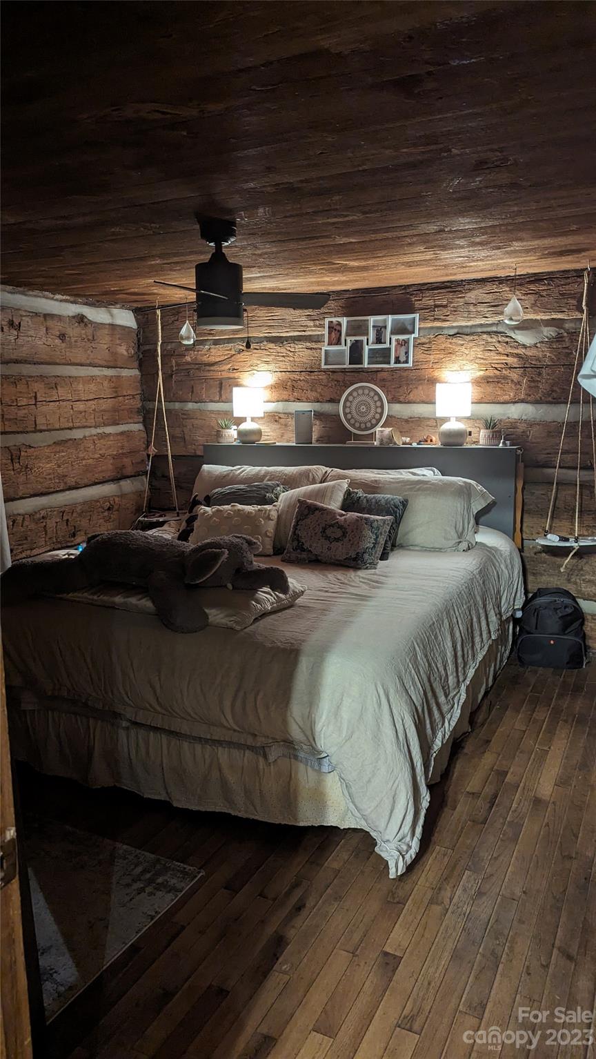 334 Ridgeview Drive Mocksville, NC 27028 - Photo 6 of 21 a bed with a black white bedspread and pillows